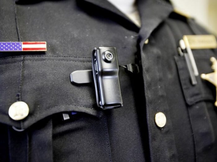 Body-Worn Camera Small Body-Worn Camera attached to officer