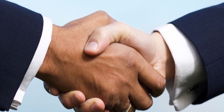 Business deal hand shake