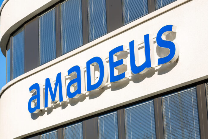 Company,Building,Facade,With,Logo,Of,Amadeus,With,Blue,Lettering